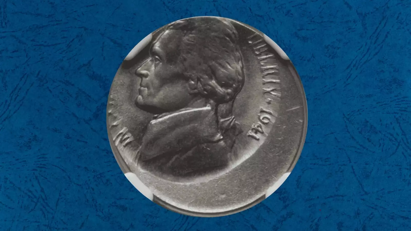 1941 Jefferson nickel off-center strike error showing missing portion of design with date still visible